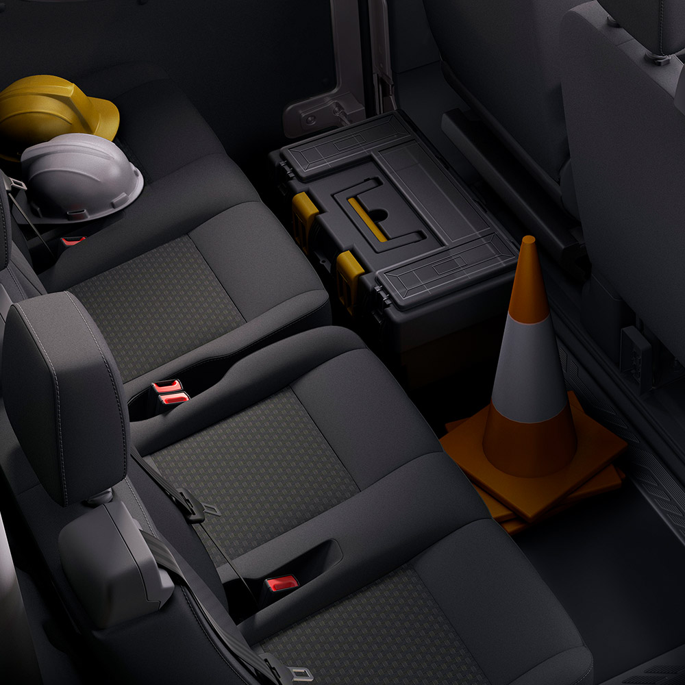 A row of dark gray seats with headrests and seatbelts.